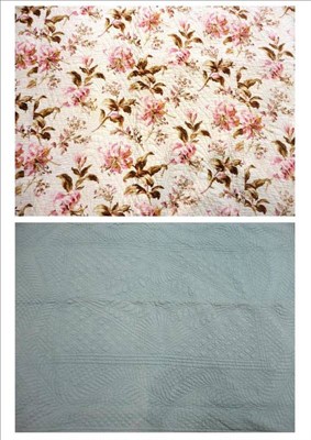 Lot 1024 - North East Blue Reversible Quilt with floral banding, 200cm by 225cm; Cream Floral Quilt with a...