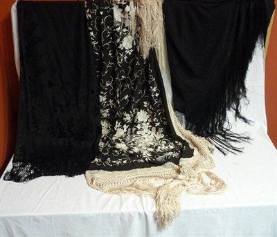Lot 1027 - Black Silk Shawl with cream floral embroidery and tassel trim; Black Silk Shawl with black silk...