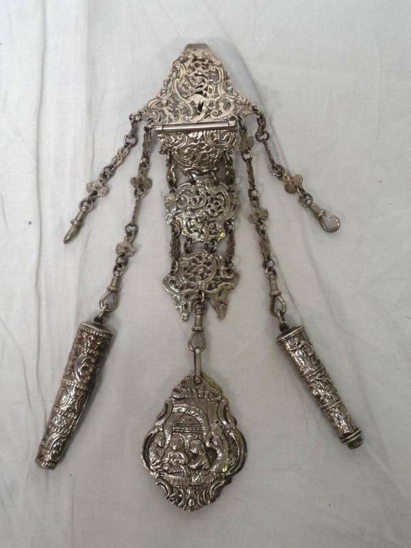 Lot 1046 - Decorative Chatelaine with a pierced and foliate clip leading to two similar links (not hall...