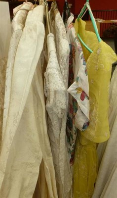 Lot 1134 - Circa 1950's Wedding Gowns including Two Cream Brocade Long Sleeved Dresses with trains and...