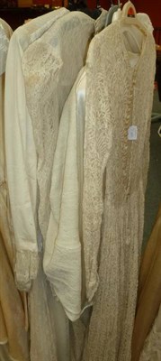 Lot 1139 - Six Early 20th Century Wedding Gowns including a full length Long Sleeved Lace Dress with...