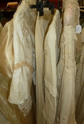 Lot 1142 - Circa 1810 Cream Silk Wedding Dress, with empire line cut bodice, short puffed sleeves (af),...