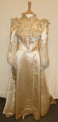 Lot 1143 - Circa 1890's Cream Satin Two Piece Wedding Costume, with fitted bodice and pleated detailing to the