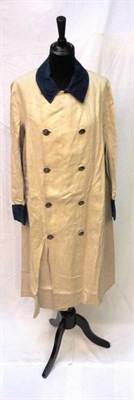 Lot 1157 - Early 20th Century Cream Linen Livery Coat with blue linen collar and cuffs, double breasted...