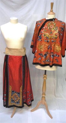 Lot 1172 - Chinese Red Figured Silk Pleated Skirt, with an embroidered panel to the front depicting a vase...