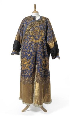 Lot 1176 - Late 19th Century Chinese Winter Dragon Robe, of blue silk embroidered with dragons, waves to...