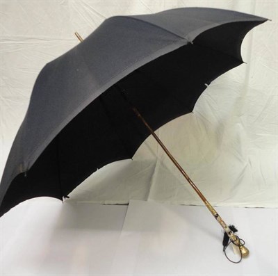 Lot 1184 - W S C & Co Reliable Parasol, with a porcelain painted handle mounted with embossed gold plate,...