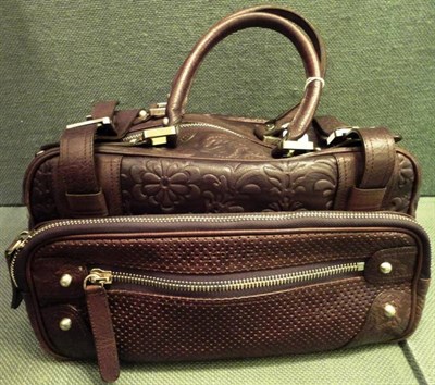 Lot 1210 - Christian Lacroix Brown Leather Handbag, with chrome fittings, zipped compartments, with a...