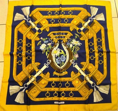 Lot 1211 - A Hermes Silk Scarf 'Aux Champs', within a mustard coloured border, boxed, 90cm