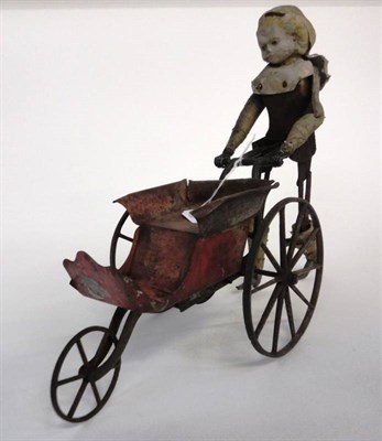 Lot 1017 - Possibly American Cast Iron Mechanical Walking Doll with Toy Pram, with three spoked wheels to...
