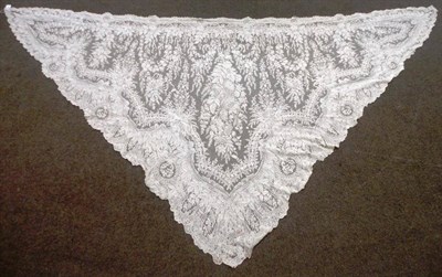 Lot 1055 - Cream Lace Triangular Shaped Shawl, decorated with foliate motifs and scallop edging, 260cm by...