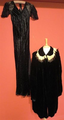 Lot 1118 - Circa 1930's Black Velvet Bias Cut Dress with lace capped sleeves; Black Velvet Opera Coat with...