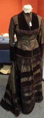 Lot 1164 - 19th Century Brown Silk Two Piece fitted bodice, lace trimmed collar, brown velvet trimmed...