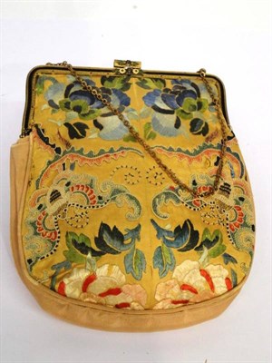 Lot 1171 - Circa 1930's Chinese Yellow Silk Embroidered Purse, with a gilt metal hinge and floral enamel...