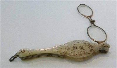 Lot 1190 - Mother of Pearl Lorgnette, carved with foliate motifs, 10.5cm long