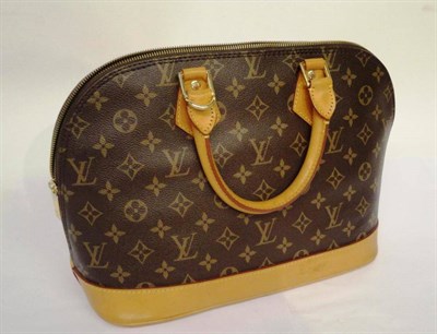 Lot 1204 - Louis Vuitton Monogrammed Canvas 'Alma' Bag, with tan leather base and handles, together with...