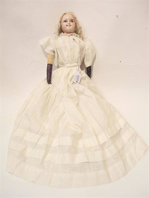 Lot 1014 - Wax Over Composition Shoulder Head Doll with blue eyes, blonde wig, on a fabric body with lower...