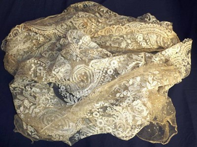 Lot 1042 - 19th Century Lace Hem, decorated with floral motifs and scallop edging, cut into two lengths of...
