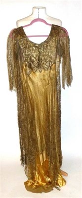 Lot 1151 - Circa 1920's Gold Satin Evening Dress with a gold lace mount, three quarter length sleeves,...