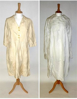 Lot 1153 - Circa 1920's Cream Silk Dress with buttons to the front, pleats and front pockets; Late 19th...