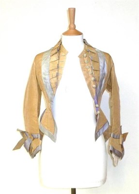 Lot 1175 - Four Late 19th Century Bodices, including a cream silk example with lilac silk trims, flared...