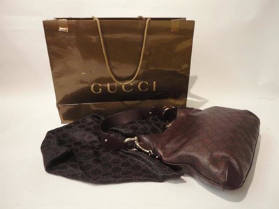 Lot 1202 - Gucci Guccissima 'Crede' Hobo Bag in brown leather embossed with 'GG' motif, with brass mounts...