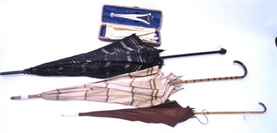 Lot 1211 - Assorted Costume Accessories including and black and cream silk parasol with ducks head knop; brown