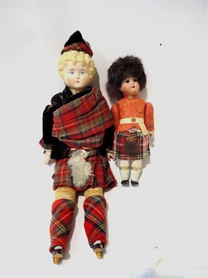 Lot 1002 - Bisque Shoulder Head Doll in Highland Dress, with moulded blond hair, painted face, bisque...
