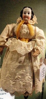 Lot 1011 - Victorian China Head Walking Doll, with moulded hair and painted face, kid leather lower arms, on a