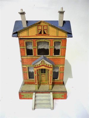 Lot 1017 - A German Blue Roof Dolls House, with a lithographed paper mount to the front, porch by the...