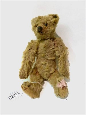 Lot 1023 - Early 20th Century Miniature Steiff Teddy, bearing a 1906 Steiff stud, with boot button eyes,...