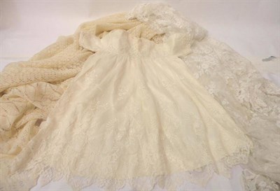 Lot 1055 - Early 20th Century Lace Wedding Veil, with floral motifs and scalloped edges; 180cm by 190cm;...