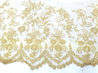 Lot 1069 - Late 19th Century Length of Lace Hem with a scalloped edge, decorated with garlands of flowers,...