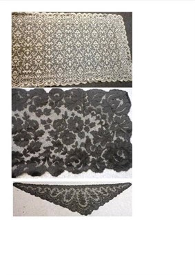 Lot 1070 - Black Lace Shawl decorated with floral motifs, 45cm by 160cm; Triangular Black Lace Shawl, 280cm by