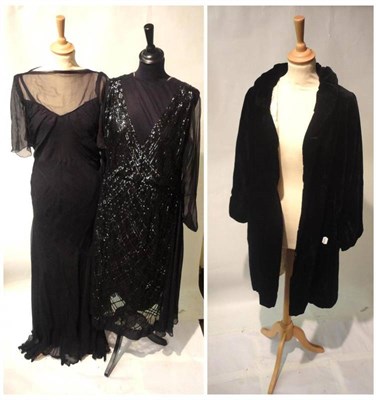 Lot 1125 - Circa 1930's Black Chiffon Bias Cut Evening Dress with capped sleeves; Black Velvet Evening...