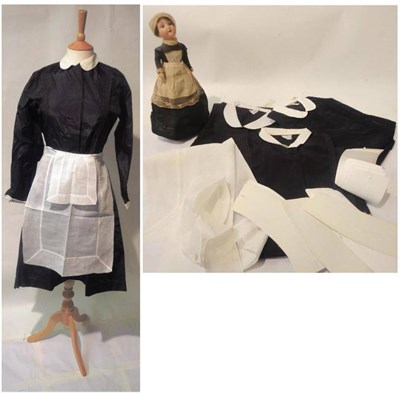 Lot 1170 - Four Harrods Maids Uniforms in black white cotton cuffs and peter pan collar, various aprons...