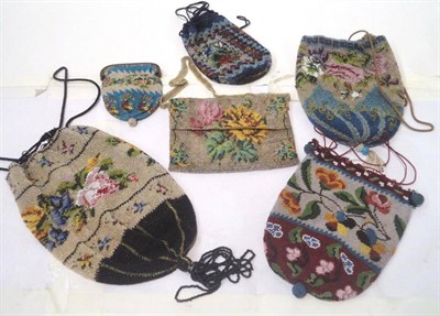 Lot 1190 - Three Large Floral Decorated Bead Work Purses with drawstring tops; another smaller with a blue...