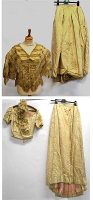 Lot 1239 - Late 19th Century Cream Silk Two Piece Costume with a v-shaped bodice, frogging style appliqued...