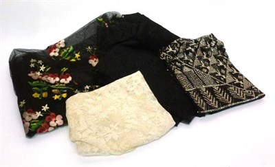 Lot 1076 - Black Assuit Shawl; Black Net Shawl embroidered with floral silk embroidery; White Lace Shawl...