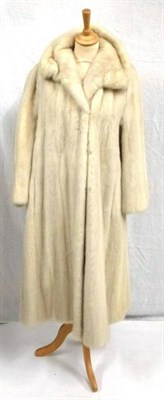 Lot 1115 - A Light Mink Short Jacket trimmed with dark mink to the cuffs, hem and collar; Fur Stole (2)