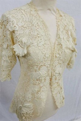 Lot 1140 - A Circa 1950s SEF London White Cocktail Dress with lace and net mounts and matching bolero...