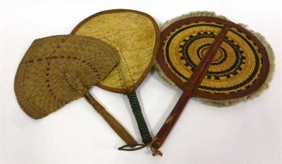 Lot 1159 - Two Nigerian and a South Seas/Polynesian Face Screens of woven circular and paddle form (3)