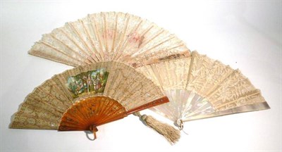 Lot 1161 - A Mother Of Pearl Fan with pierced and silver gilt painted sticks and guards, lace mounted with two