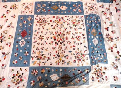 Lot 1036A - Large Canadian Bed Cover on a cream ground with large blue panels and patchwork appliques in...