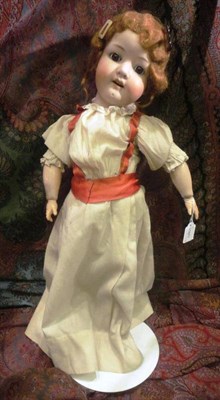 Lot 1001 - A Koppelsdorf Bisque Socket Head Doll impressed '302.4' with auburn hair, sleeping brown eyes, on a