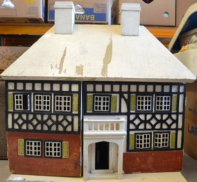 Lot 1014 - Circa 1930's Triang Style Dolls House, front opening enclosing four rooms and central hallway,...