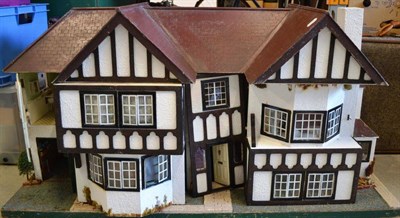 Lot 1015 - Circa 1930's No 92 Triang Dolls House, front opening enclosing five rooms, with a central...