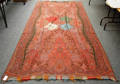 Lot 1025 - A Late 19th Century Woven Paisley Cloth with a red ground, 340cm by 160cm