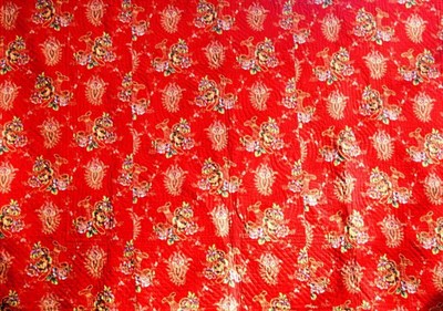 Lot 1043 - Late 19th Century Reversible Red Quilt printed with paisley motifs and baskets of flowers, 215cm by
