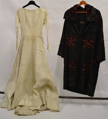 Lot 1134 - Circa 1930's Floral Brocade Wedding Dress with long sleeves, scooped neckline, train to the...